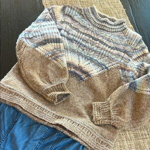 Democracy Sweater in SZ Petite Small.
Sweater is wool blend, soft and luxurious